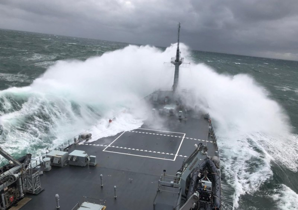 photo of a naval ship in rough weather equipped with davits from vestdavit