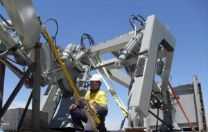 Photo of an engineer conducting Upgrades and Modifications on a davit system onboard a vessel